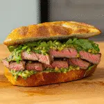 steak chimichurri sandwich sliced open